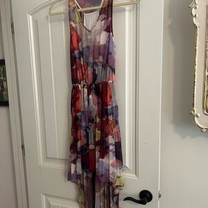 Multi color guess dress. Short in the front and long in the back.